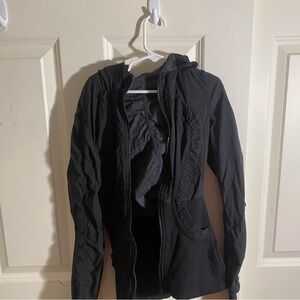 LuluLemon. Zip up jacket. No zipper. The jacket is reversible..